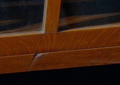 Small gouge in the horizontal support below the bottom of the door. 